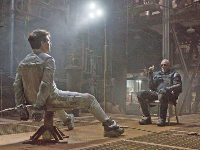 Tom Cruise, left, and Morgan Freeman in a scene from 'Oblivion'