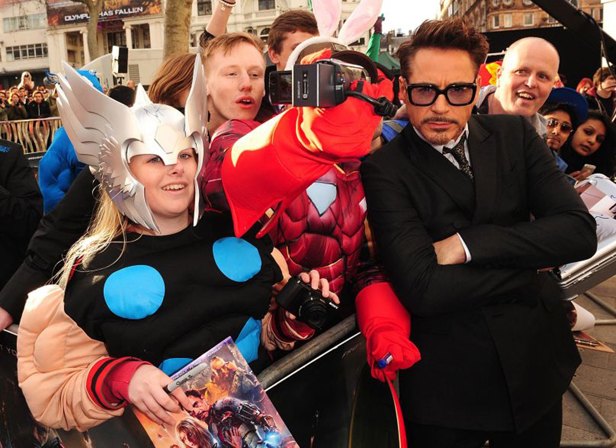 Robert Downey Jr poses with fans at the premiere of Iron Man 3 at the Odeon Leicester Square, London