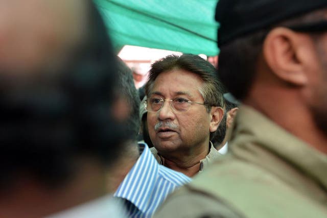 Former Pakistani president Pervez Musharraf is escorted by soldiers as he arrives at an anti-terrorism court in Islamabad 