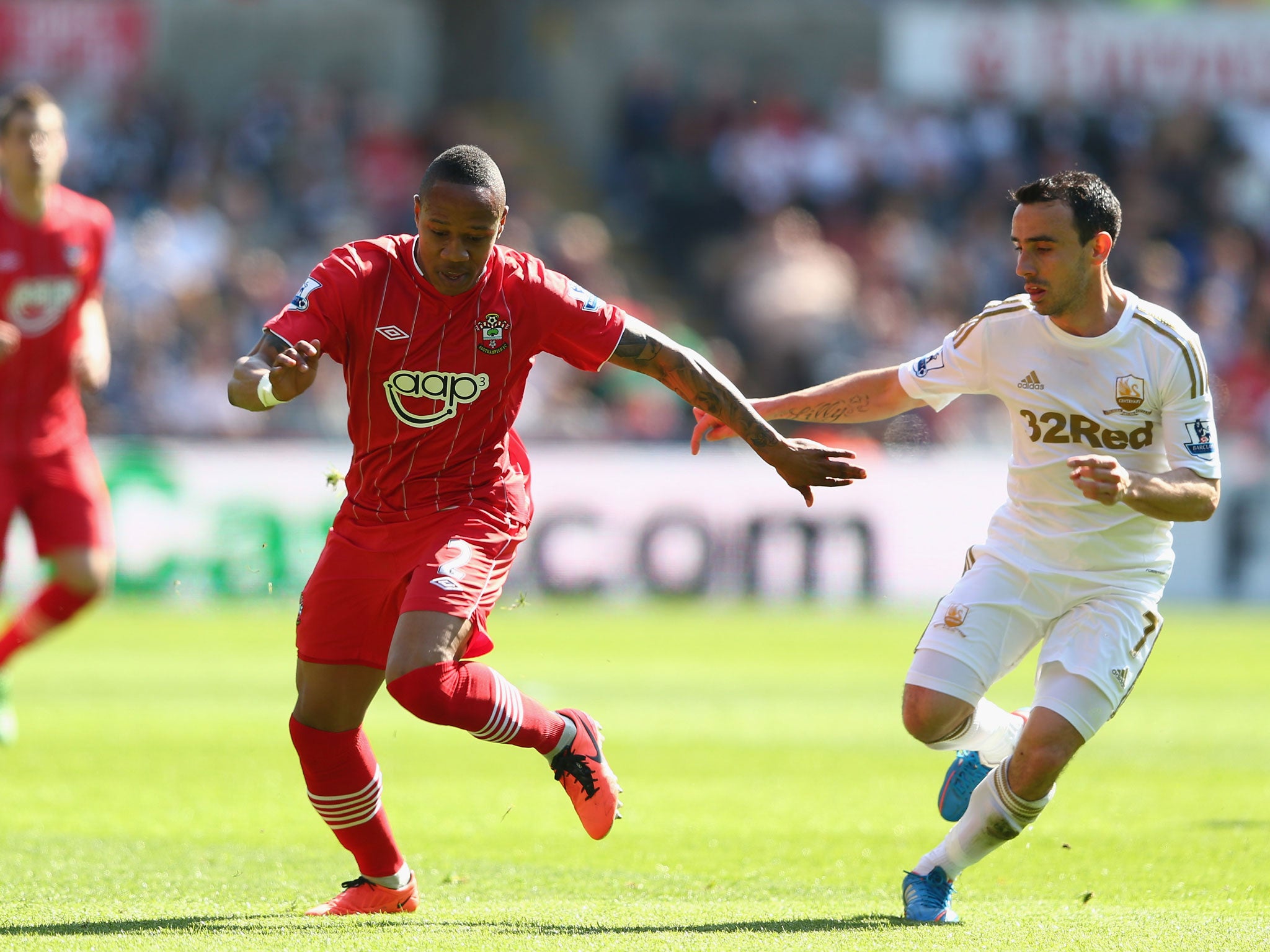Southampton's Nathaniel Clyne battles with Swansea's Leon Birtton
