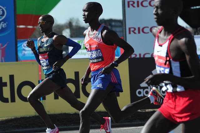 Mo Farah runs as he completes his half-marathon