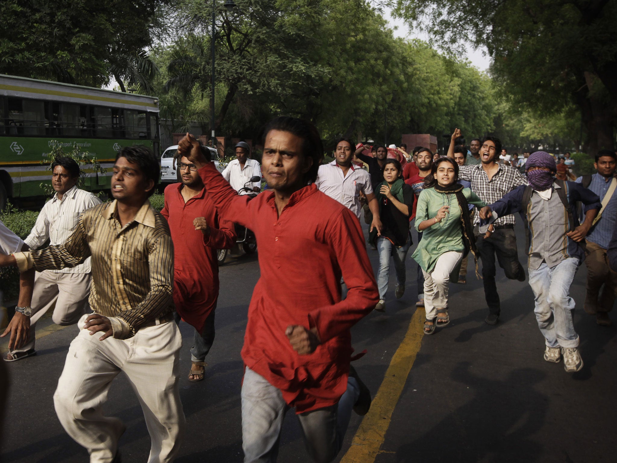 Indian protestors shouting slogans rush towards the Prime Minister's residence during a protest against the rape of a 5-year-old girl in New Delhi, India