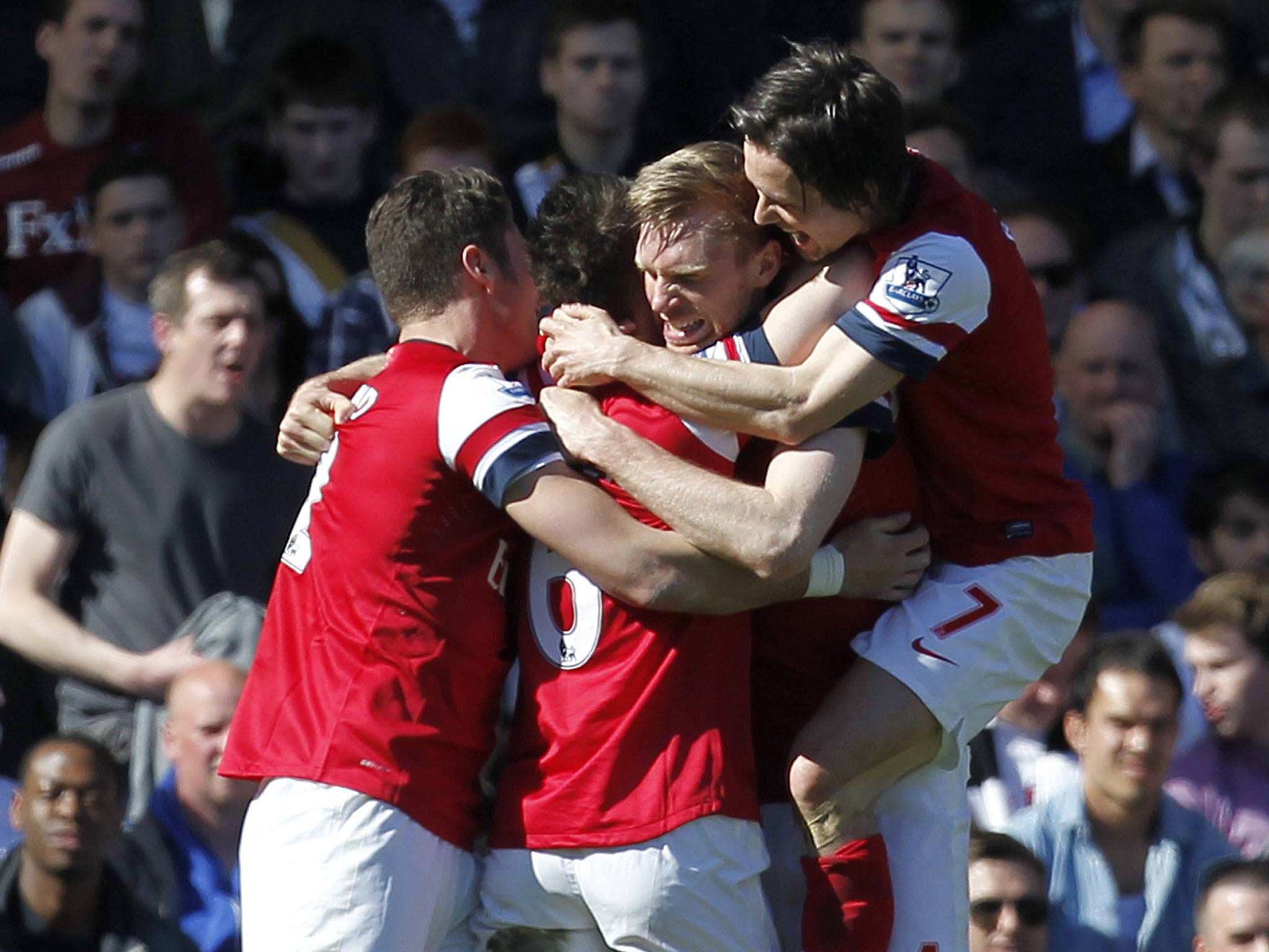 Per Mertesacker is congratulated after scoring the only goal of the game in Arsenal's 1-0 win over Fulham
