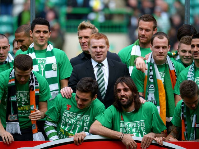 Neil Lennon is at the centre of celebrations after Celtic clinch the title