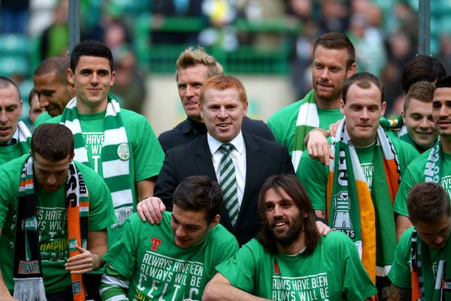 Neil Lennon is at the centre of celebrations after Celtic clinch the title