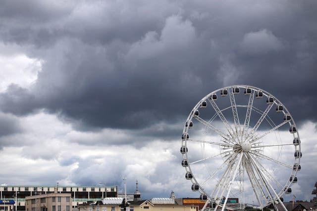 Rain clouds gather above the big wheel on the seafront on August 30, 2011 in Weston-Super-Mare, England.
