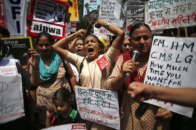 Indian women protest against how Indian authorities handle sex crimes near the Parliament in New Delhi, India