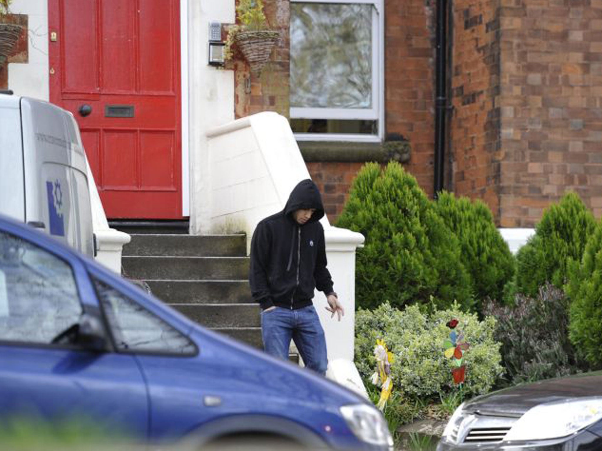 Luis Suarez leaves his home in Liverpool
