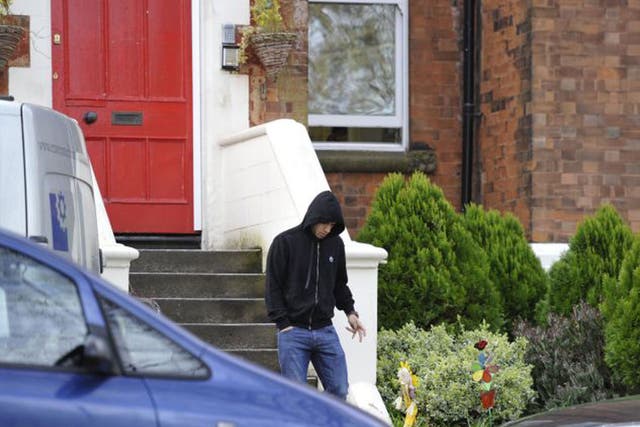 Luis Suarez leaves his home in Liverpool