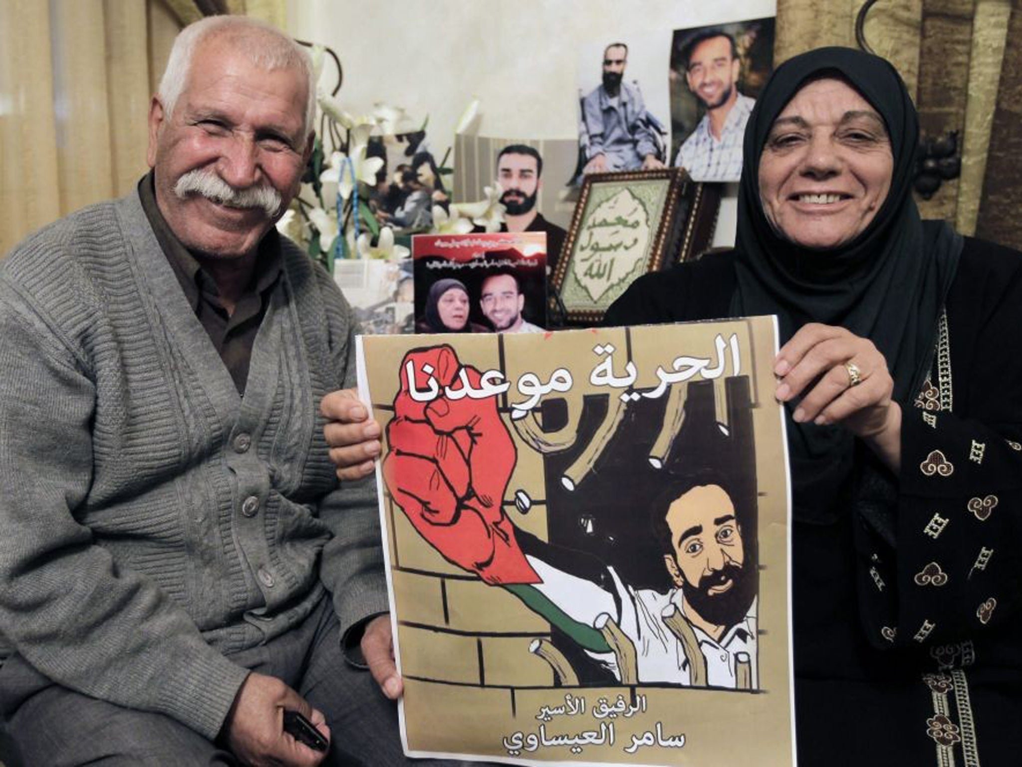 The parents of Palestinian hunger-striking prisoner Samer Issawi at their home in the Issawiya neighborhood in Arab East Jerusalem as they rejoice that their son has decided to end his hunger strike
