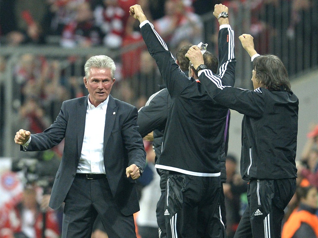 Bayern Munich's head coach Jupp Heynckes celebrates with his coaching staff