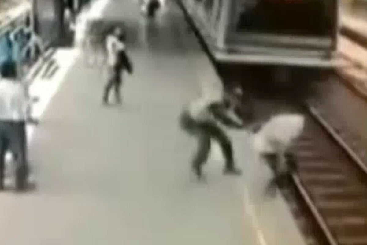 Video: The dramatic moment a police officer saves man from an oncoming ...