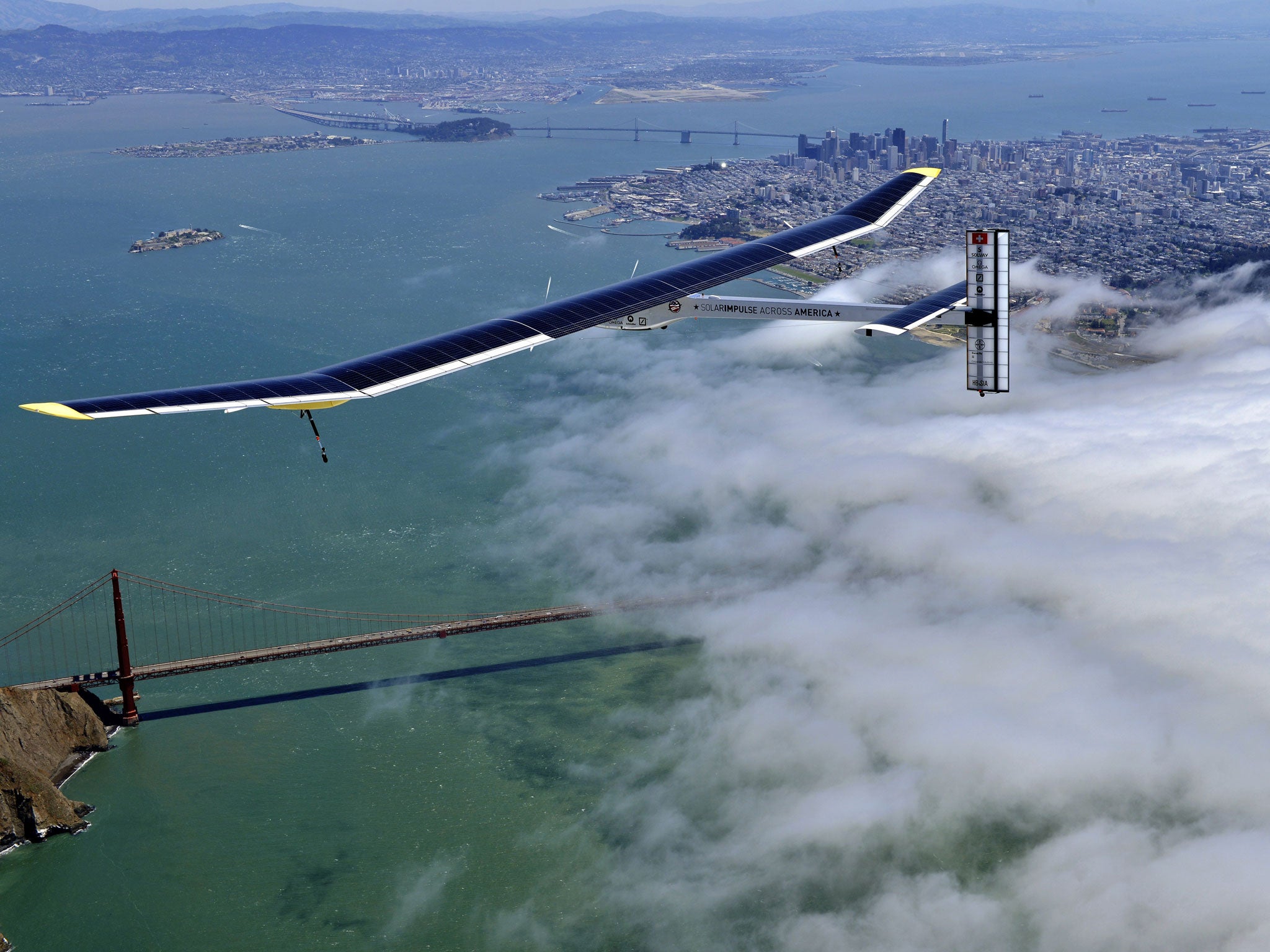 The Solar Impulse glides over the Golden Gate Bridge in San Francisco
