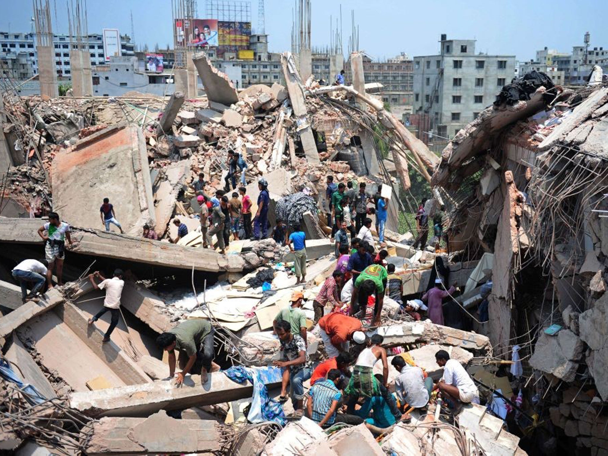 Bangladeshi civiliant volunteers assist in rescue operations after an eight-storey building collapsed in Savar, on the outskirts of Dhaka