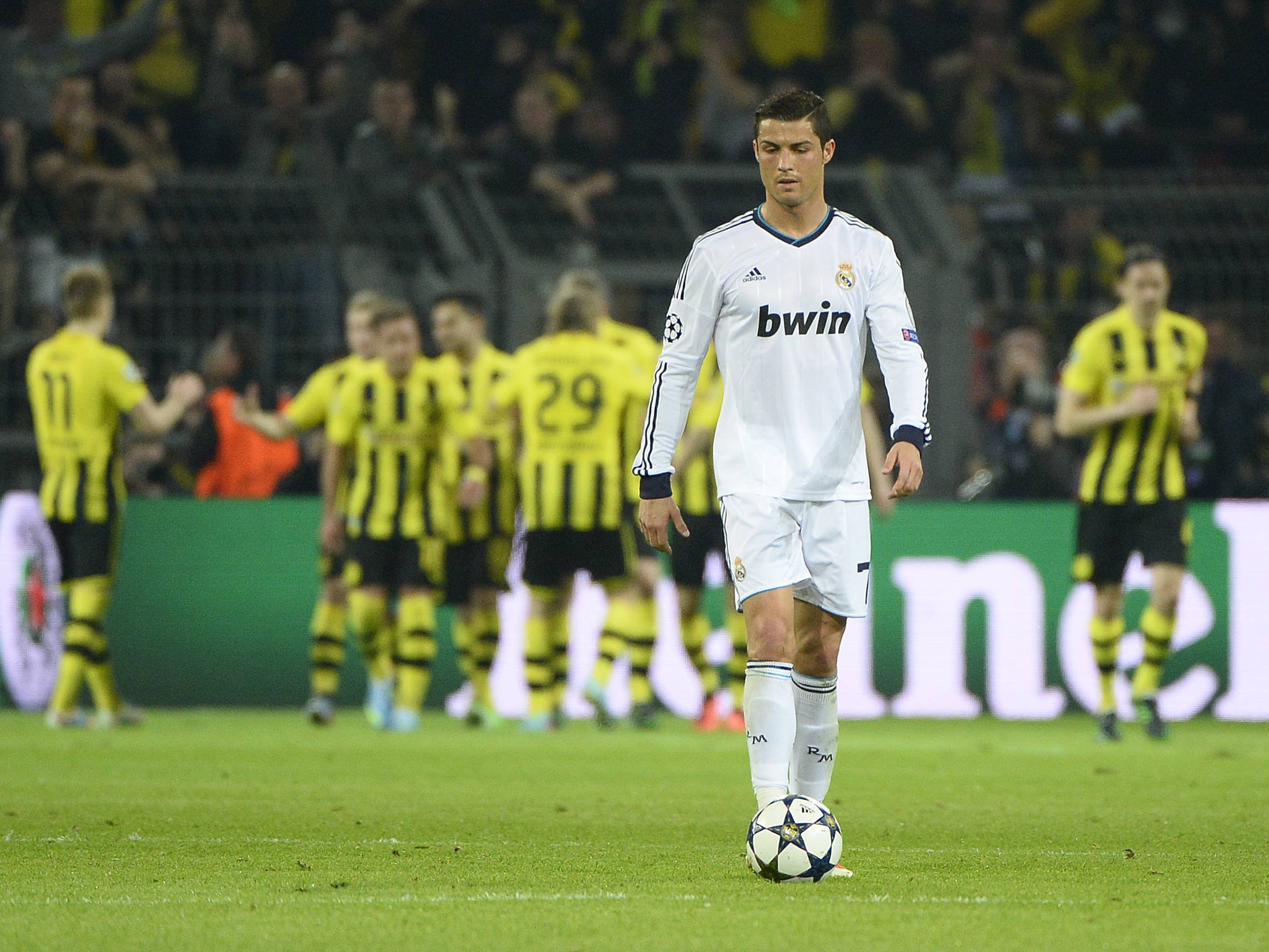 Cristiano Ronaldo pictured in action as Dortmund celebrate a goal in their 4-1 win over Real Madrid