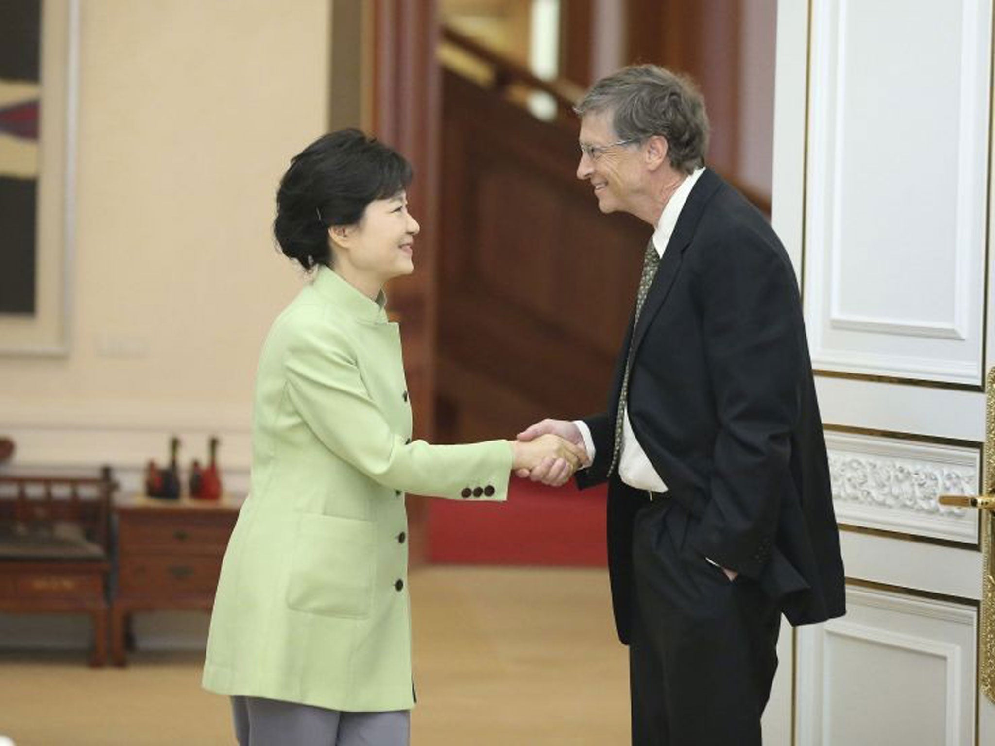 The Microsoft founder has been accused of disrespecting the South Korean President, Park Geun-hye, after he was pictured shaking hands with her - with his other hand firmly in his pocket.