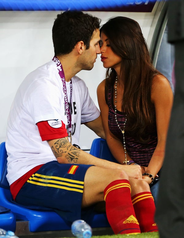 Cesc Fabregas of Spain kisses his girlfriend Daniella Semaan