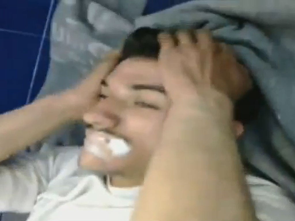 A man in the video is shown foaming at the mouth - allegedly due to chemical weapons
