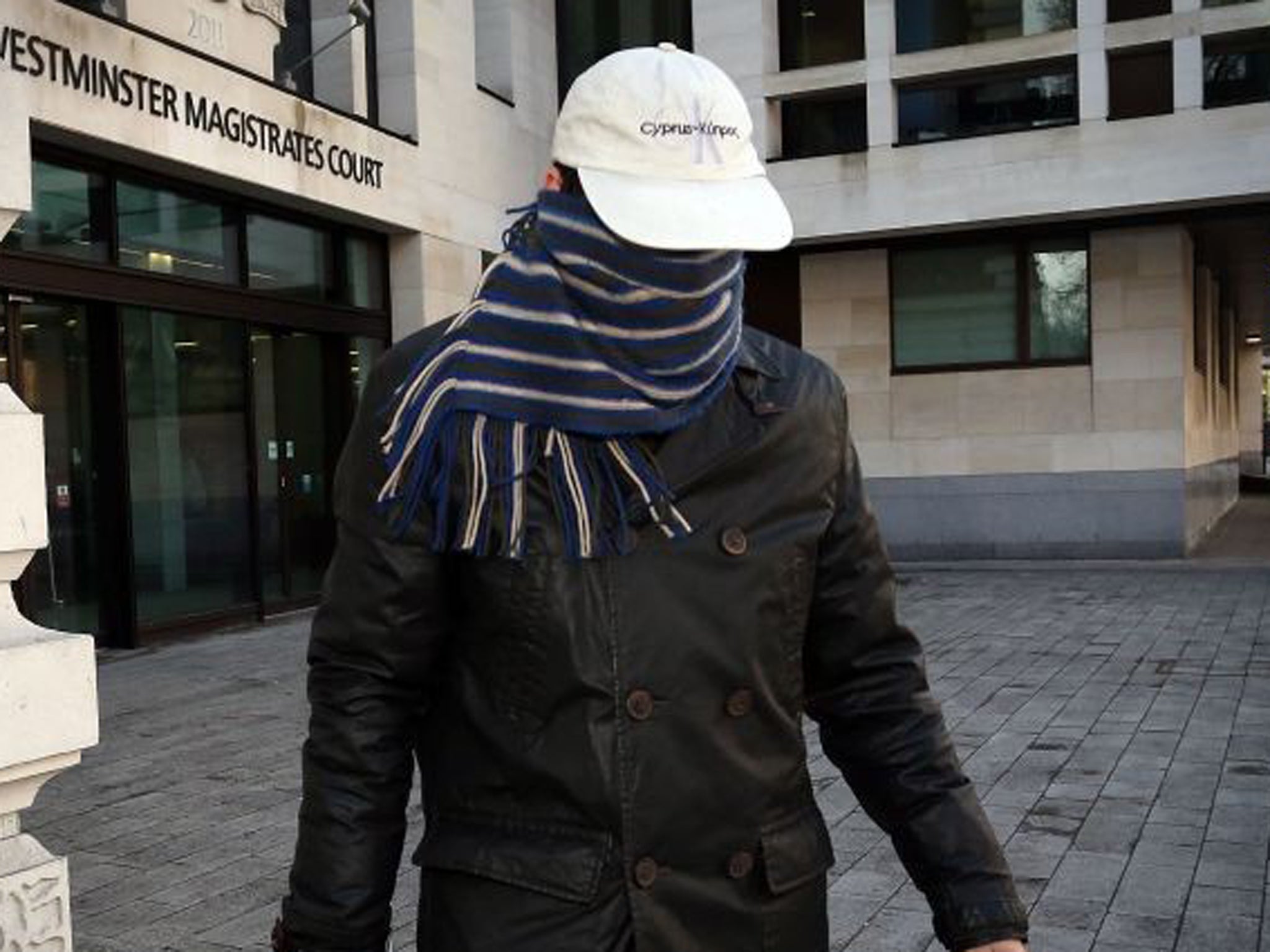 Mark Lancaster left the court with his face swathed in a scarf and wearing a baseball cap
