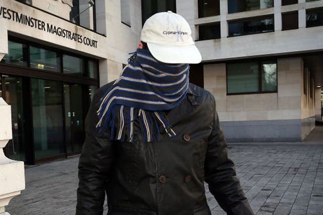 Mark Lancaster left the court with his face swathed in a scarf and wearing a baseball cap