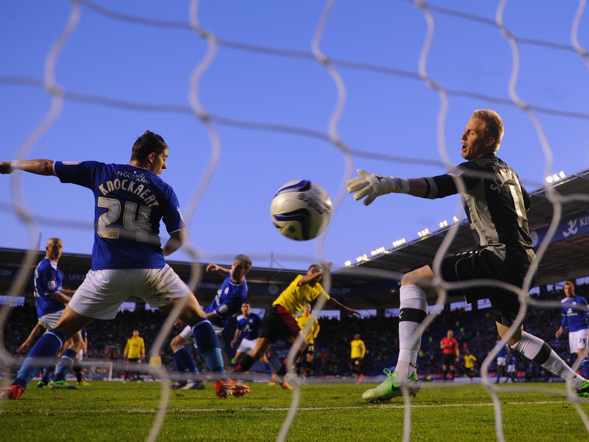 Anthony Knockaert and Kasper Schmeichel of Leicester can't stop Troy Deeney of Watford scoring to make it 1-0