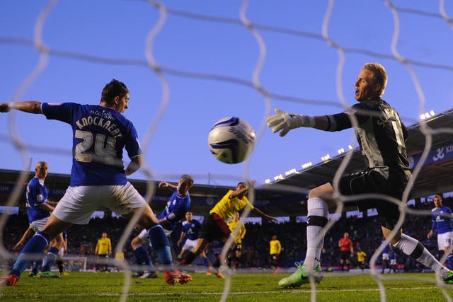 Anthony Knockaert and Kasper Schmeichel of Leicester can't stop Troy Deeney of Watford scoring to make it 1-0
