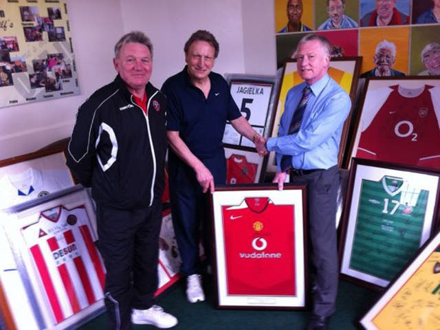 Sheffield United great Tony Currie (left) watches me hand over a signed Ryan Giggs shirt to Kevin Bradley, director ofSt Wilfrid’s 