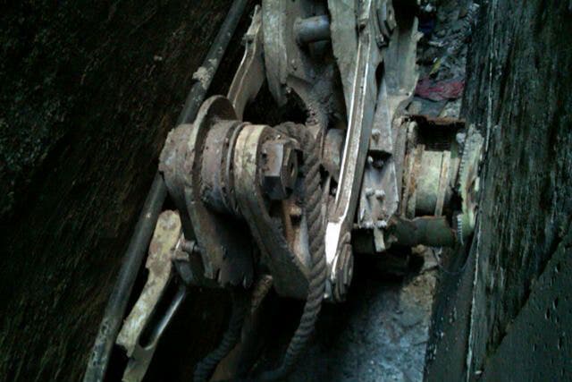 Part of a landing gear, apparently from one of the commercial airliners destroyed on September 11, 2001,  discovered wedged between the rear of 51 Park Place and the rear of the building behind it, 50 Murray Street