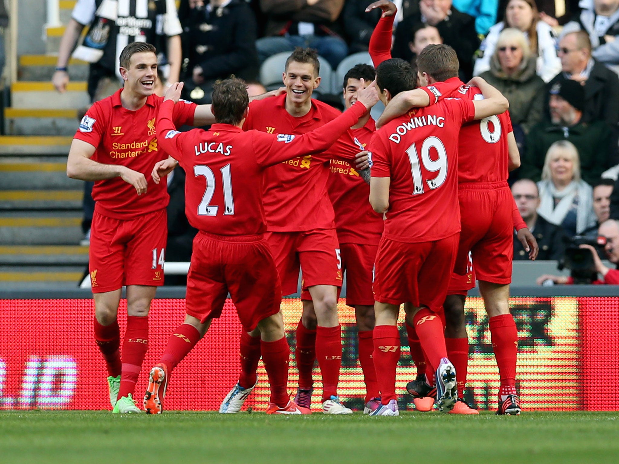 Liverpool's Danish defender Daniel Agger (C) celebrates with teammates after scoring a goal