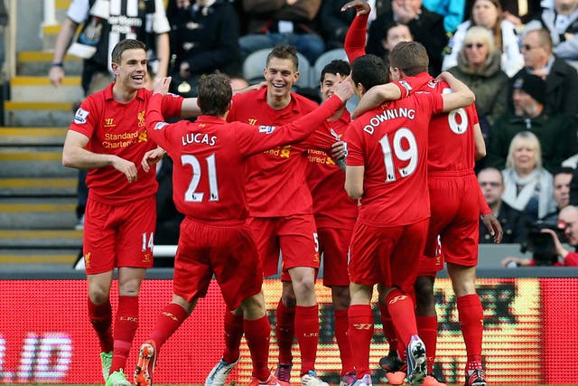 Liverpool's Danish defender Daniel Agger (C) celebrates with teammates after scoring a goal 
