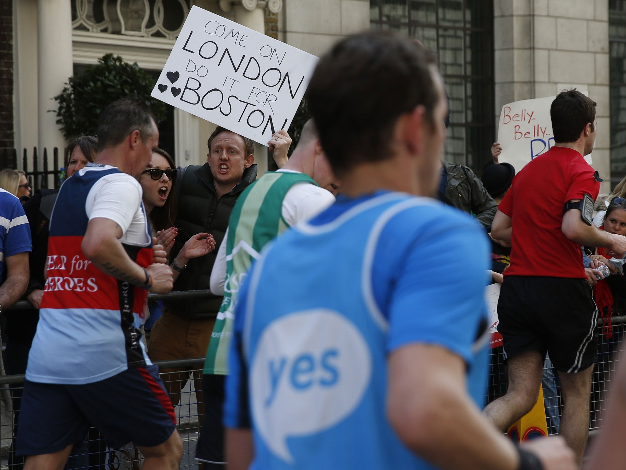 Defying the bombers: Spectators demonstrating their support for Boston at the London Marathon