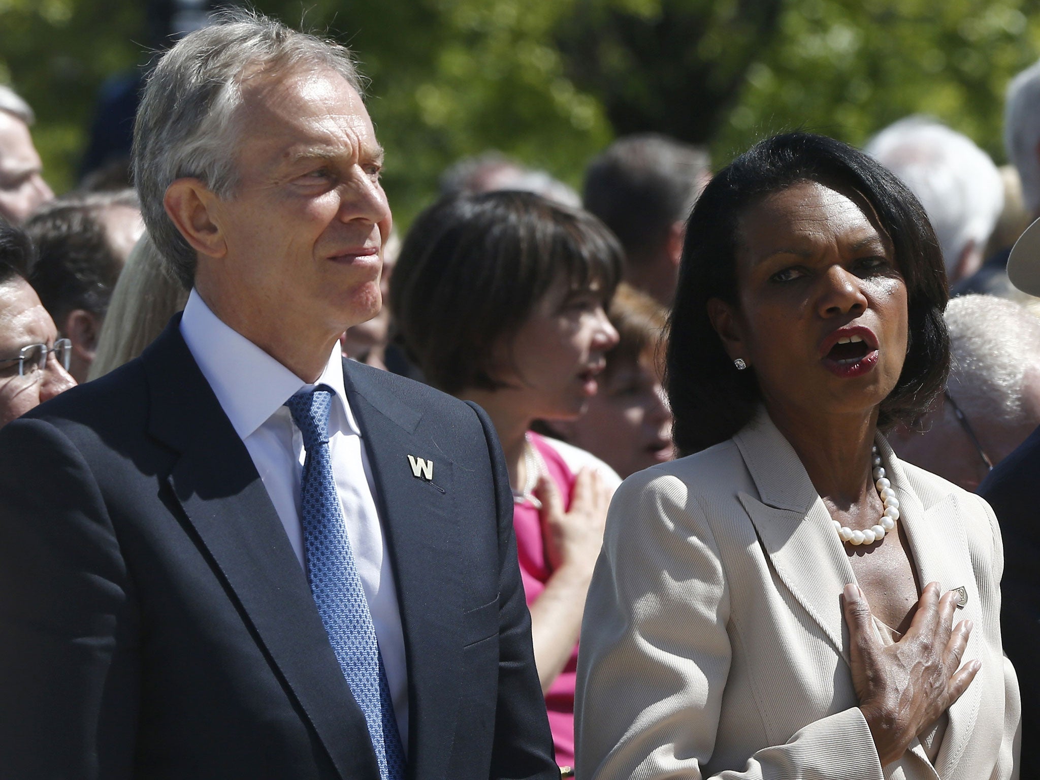 Former Prime Minister Tony Blair stands next to former Secretary of State Condoleezza Rice, at the opening of the George W Bush Library