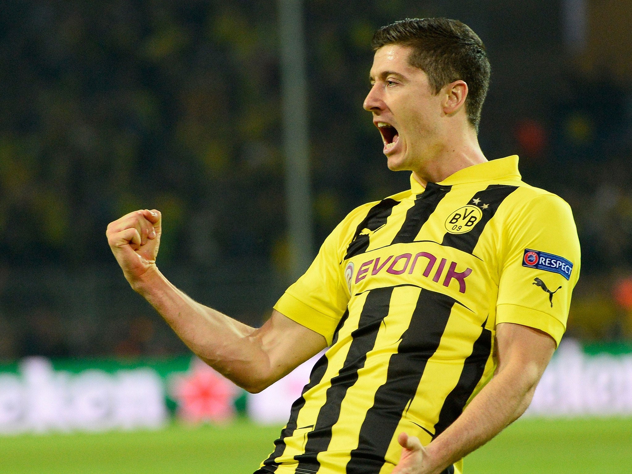  Robert Lewandowski celebrates a goal for Borussia Dortmund during a match.