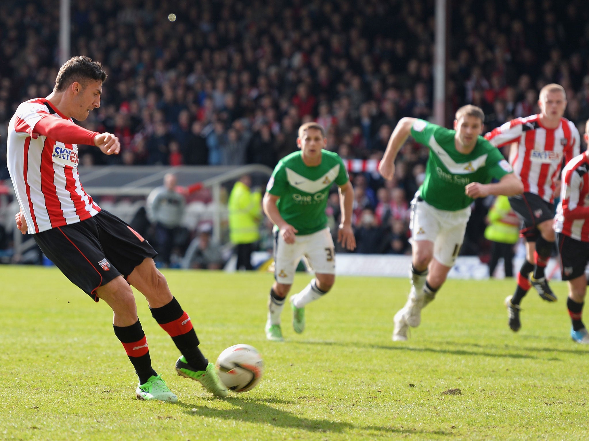 Spot of bother: Brentford substitute Marcello Trotta about to hit his late penalty against the bar