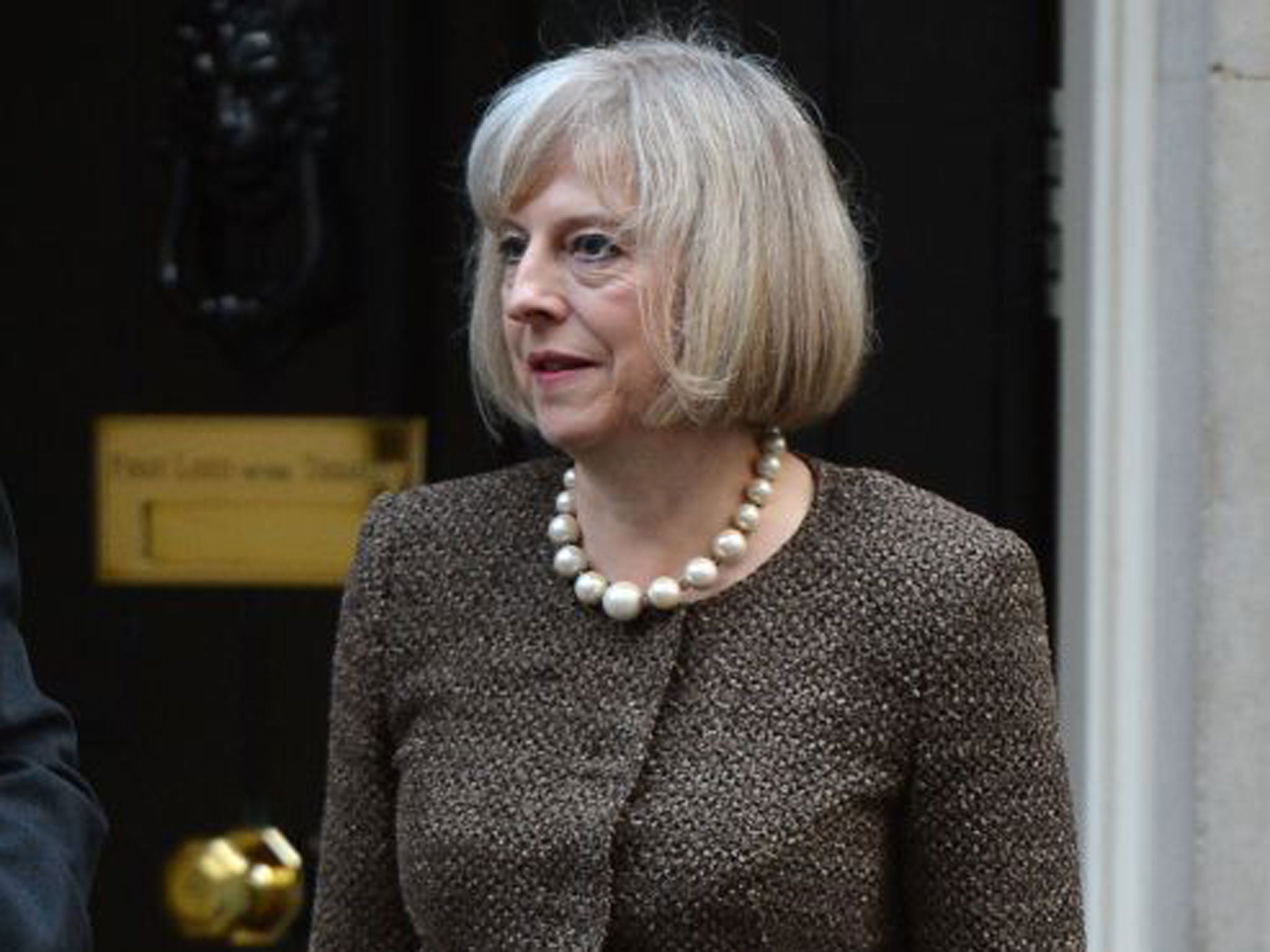 Criminal suspects who have been arrested should not normally be named until they are charged, the Theresa May says
