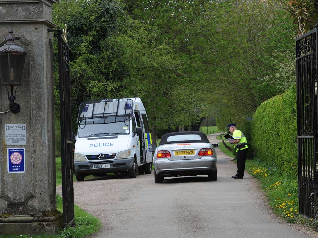 Police at the gate to Down Hall Country House Hotel in Hatfield Heath