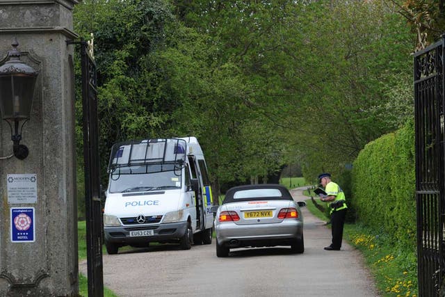 Police at the gate to Down Hall Country House Hotel in Hatfield Heath