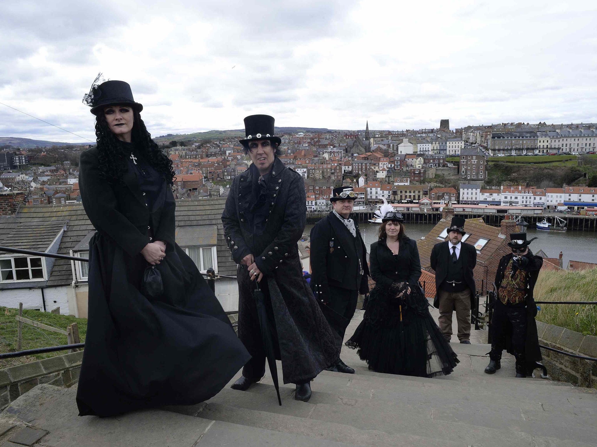 Goths pose for photographs during the Goth festival in Whitby, northern England