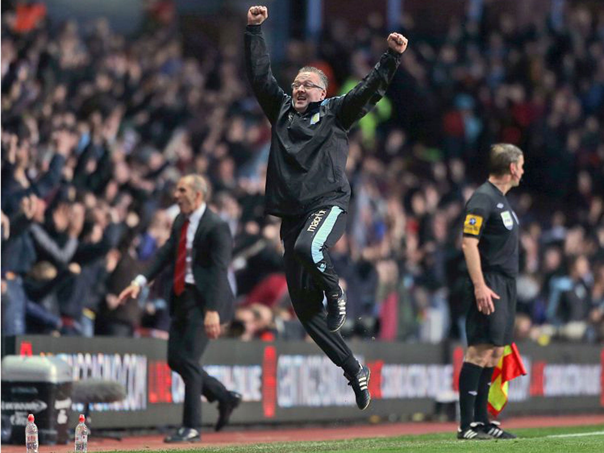Aston Villa manager Paul Lambert, centre, celebrates on the touchline after Ron Vlaar scores his side's first goal of the game against Sunderland during the English Premier League soccer match at Villa Park, Birmingham