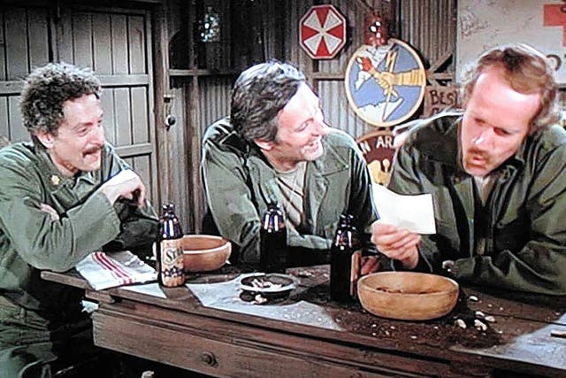 Arbus, left, with Alan Alda as Hawkeye and Mike Farrell as BJ Hunnicutt in an episode of 'M*A*S*H'
