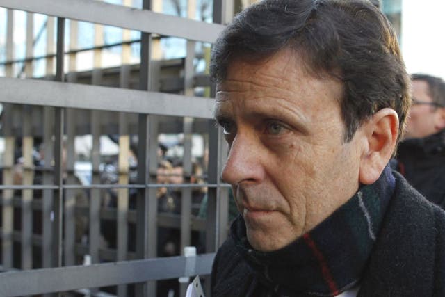 Doctor Eufemiano Fuentes arrives at a court house in Madrid. He received a suspended one-year jail term for providing blood-doping services to cyclists