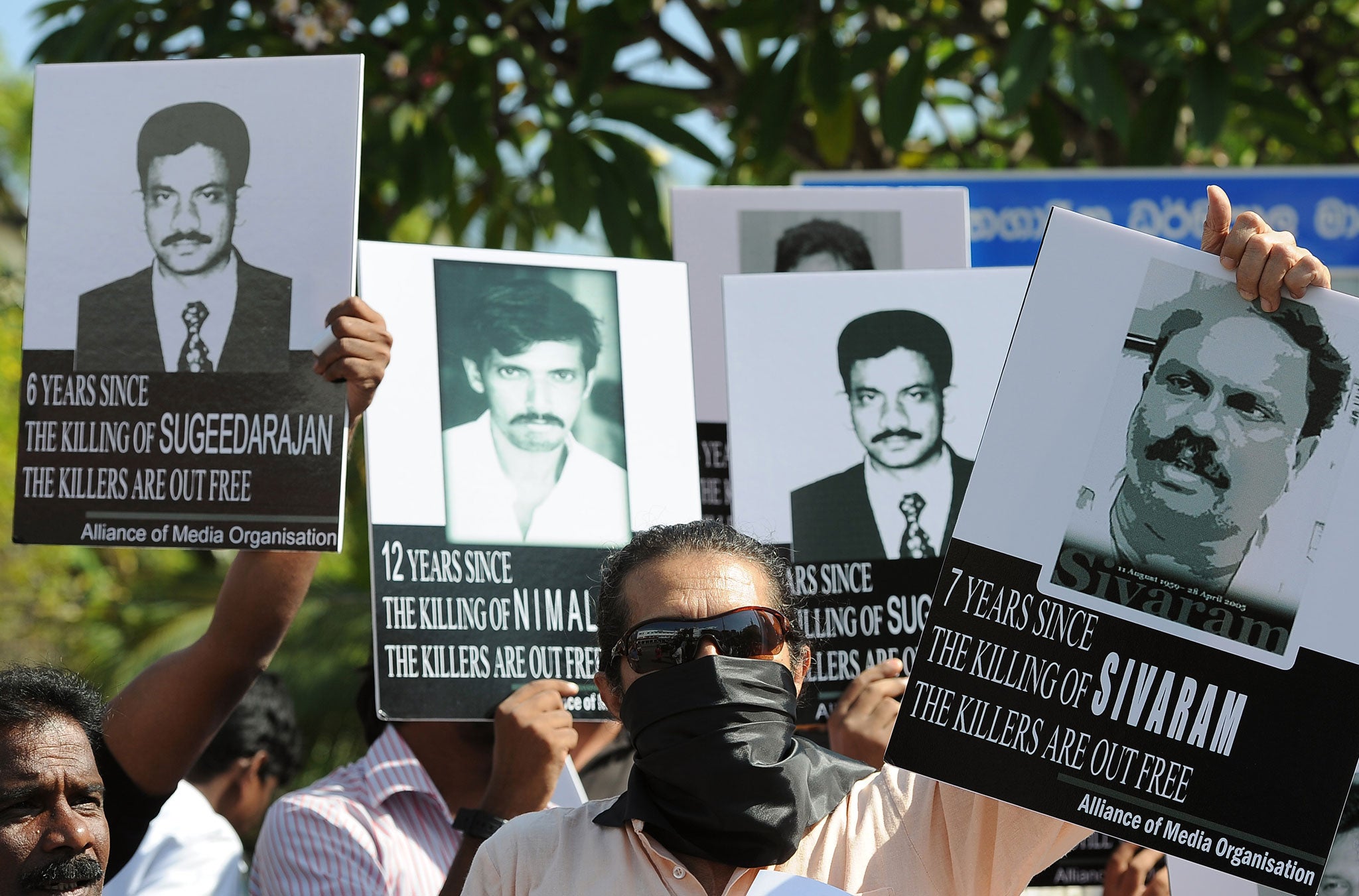Sri Lankan journalists and media activists demonstrate, demanding investigations into over a dozen killings of editors, reporters and newspaper workers in recent years, in the capital Colombo