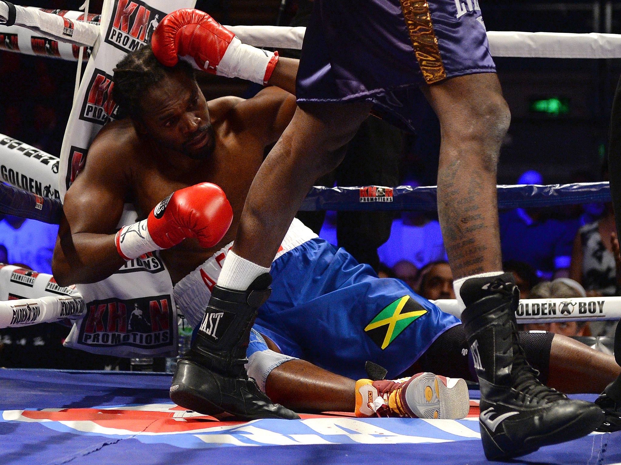 Britain's Audley Harrison (L) is knocked out by US Deontay Wilder during the first round of their International Heavyweight Contest at the Motorpoint Arena in Sheffield