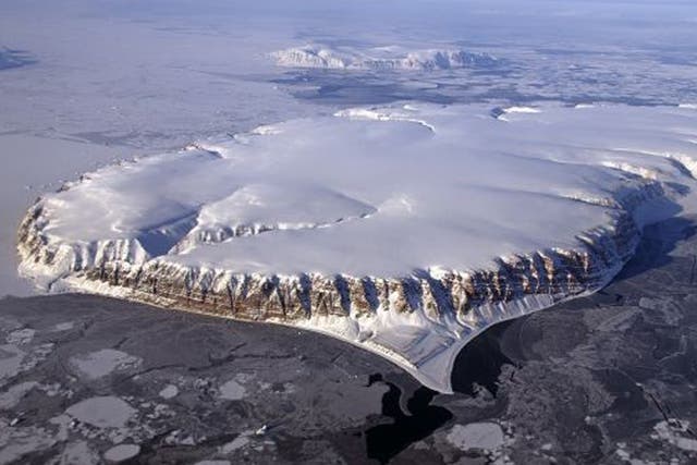 This Nasa image from 20 April 2013 shows Saunders Island and Wolstenholme Fjord with Kap Atholl in the background seen during an IceBridge survey flight near  Qaasuitsup, Greenland