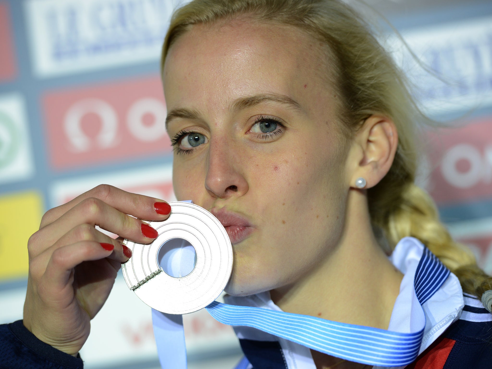 Britain's Lynsey Sharp kisses her silver medal at the 2012 European Athletics Championships. She was latter awarded a gold medal after her rival in 800m was banned for doping