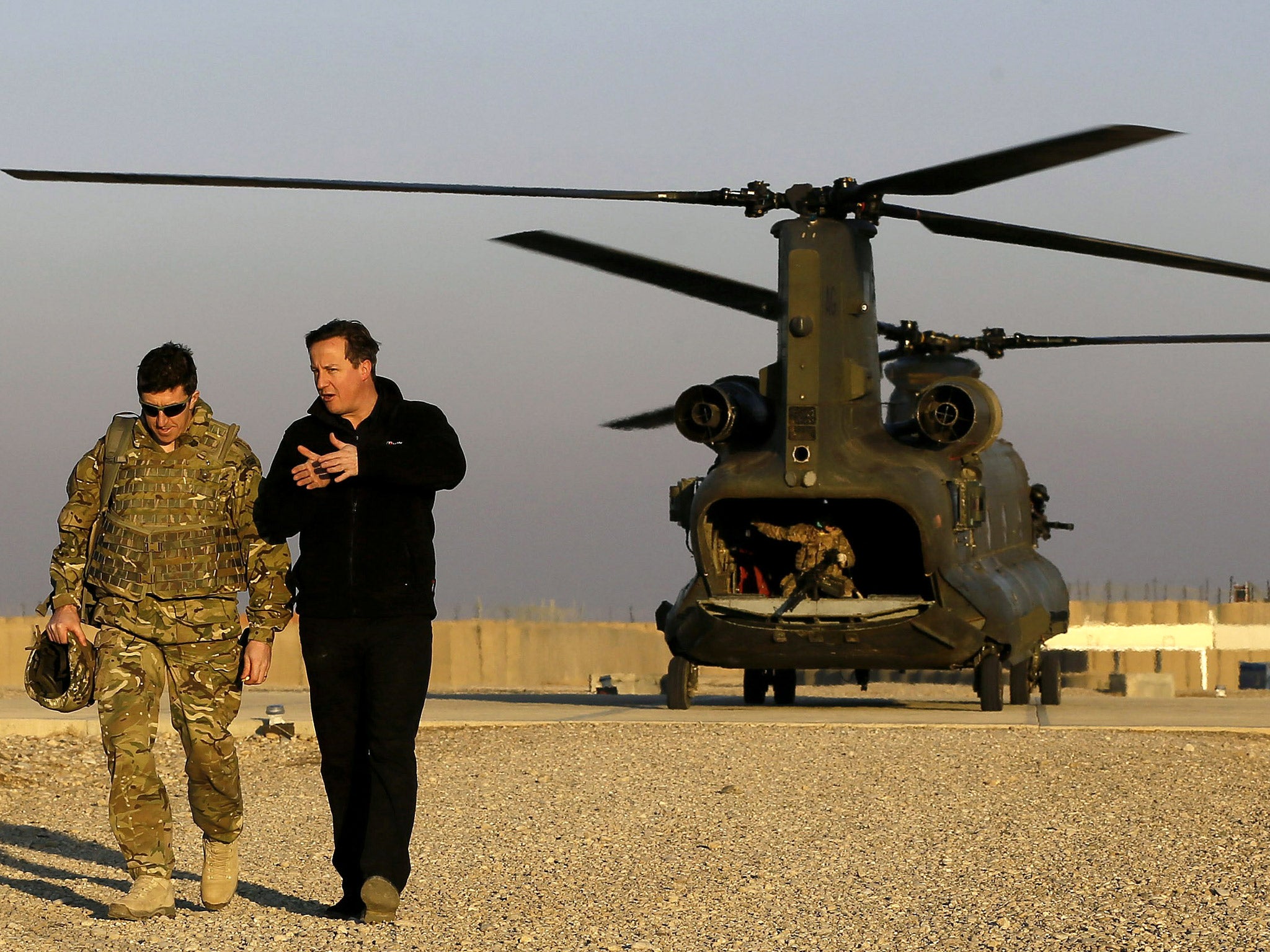 David Cameron during a visit to troops in Afghanistan last December 