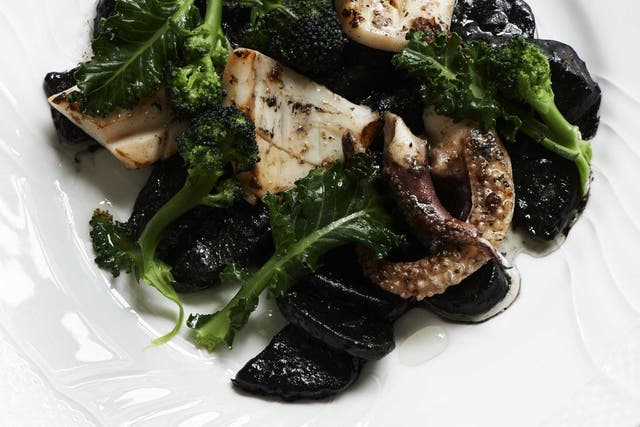 Ink potatoes with sprouting broccoli and squid