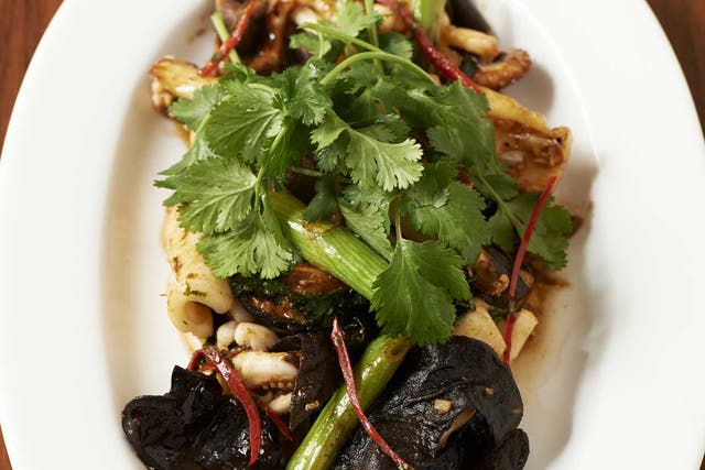 Stir fried squid with green onions, ginger and mushrooms