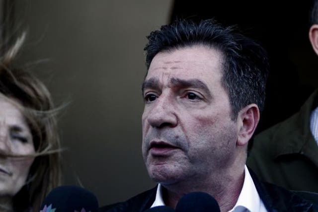 Athens mayor Giorgos Kaminis talks to reporters after the incident