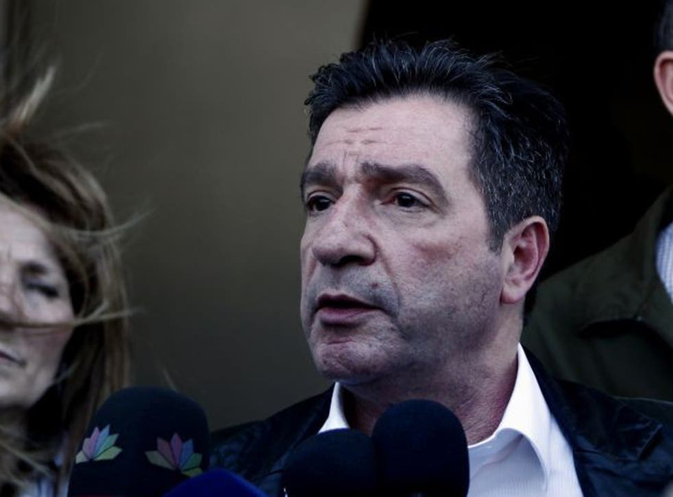 Athens mayor Giorgos Kaminis talks to reporters after the incident